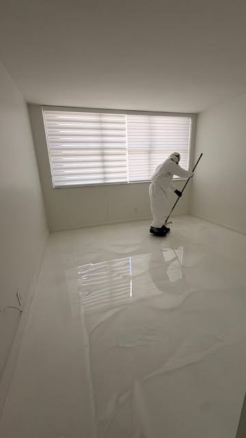 Metallic epoxy floor with unique swirls by Epoxy City